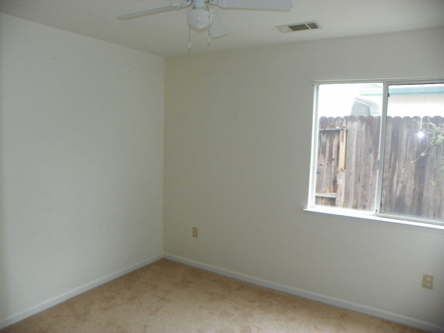 710 Mallard Street Redding, CA 96003 - Photo 9 of 19 an empty room with a window