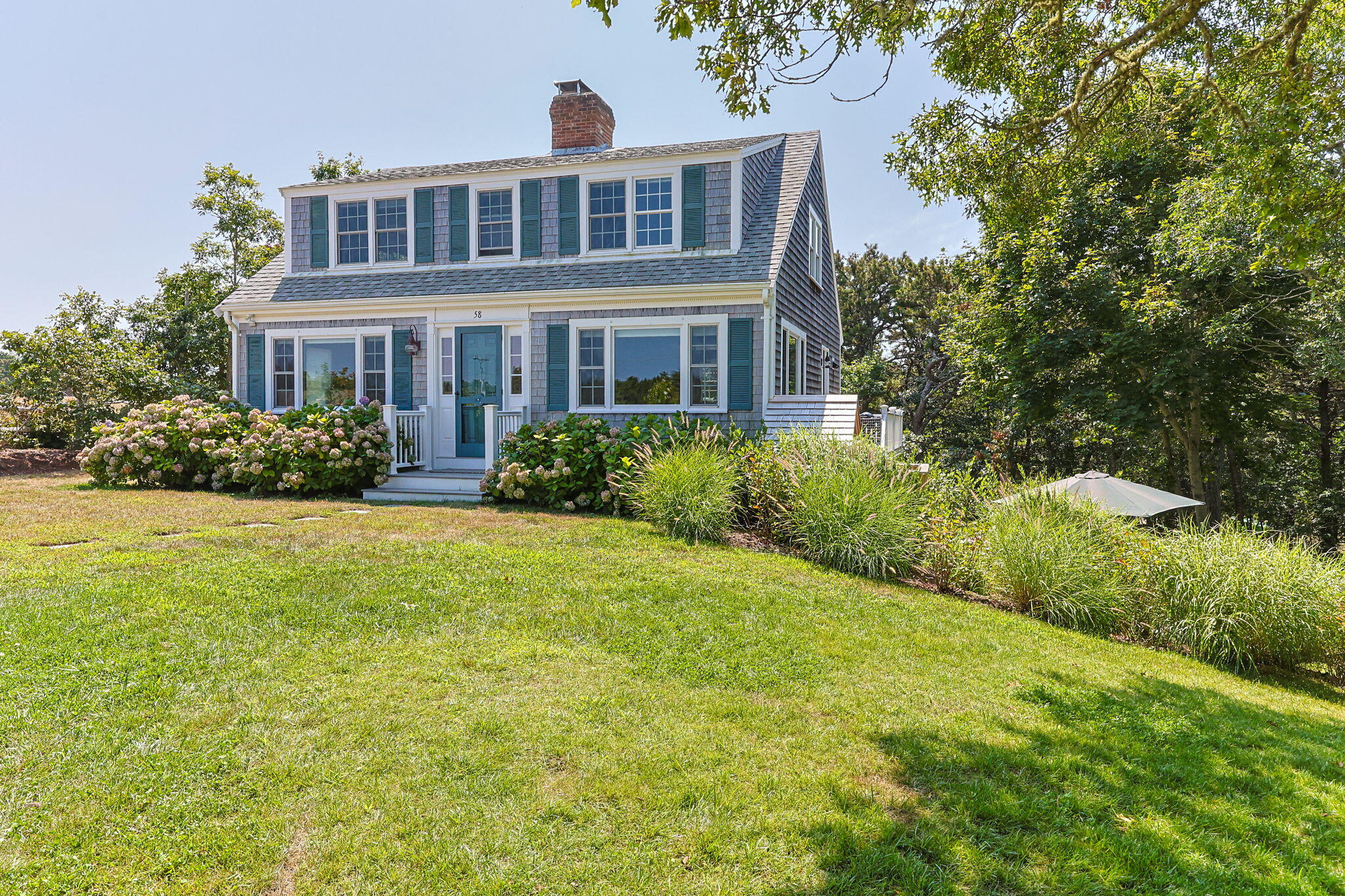 58 Stepping Stones Road Chatham, MA 02633 - Photo 1 of 52 a front view of a house with a yard