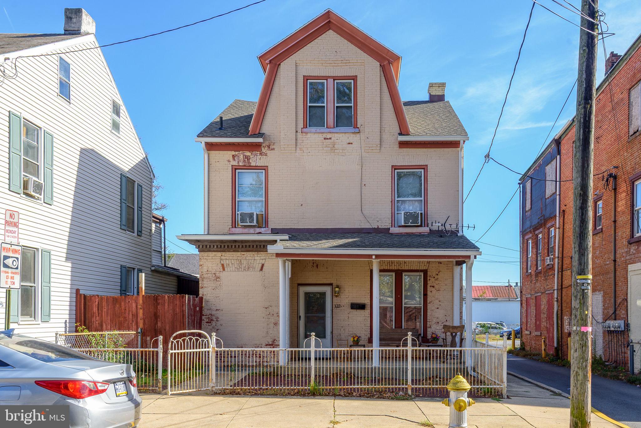 a front view of residential houses with yard