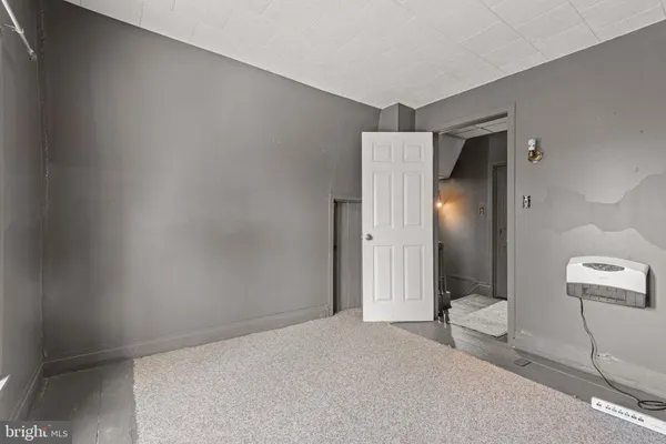 a view of a bathroom with mirror