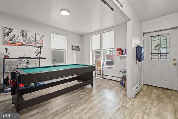 a bedroom with furniture and window