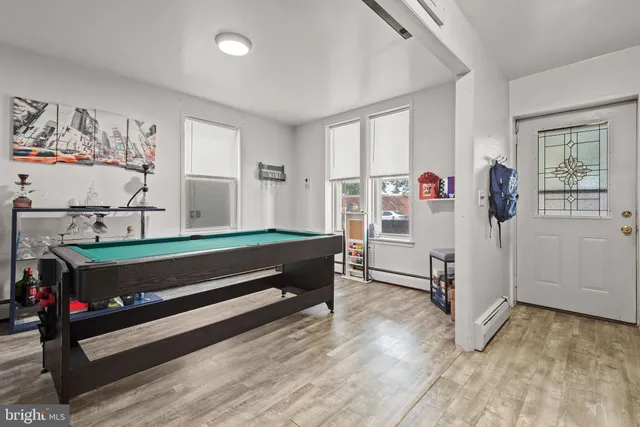 a bedroom with furniture and window