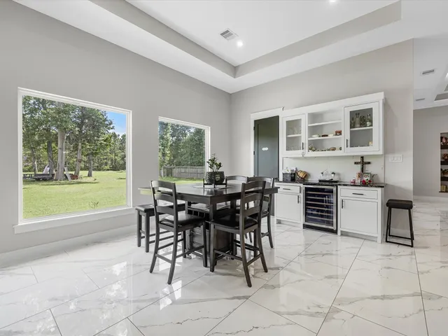 a view of a dining room kitchen and patio