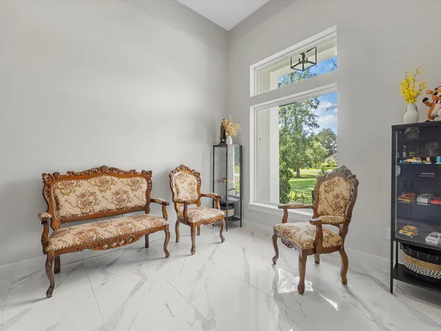 a living room with furniture and a window