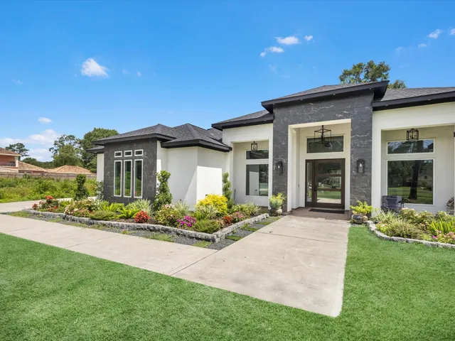 front view of a house with a garden
