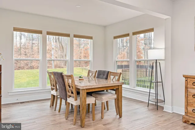 a bedroom with a bed and a wall painting