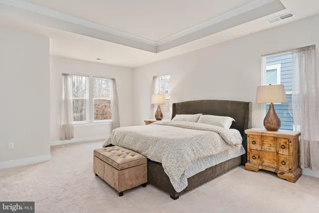 a view of a patio with a table and chairs under an umbrella