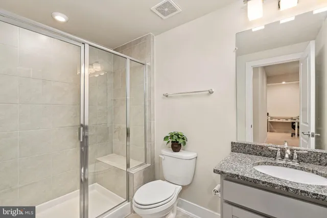 an aerial view of a house with a garden and swimming pool