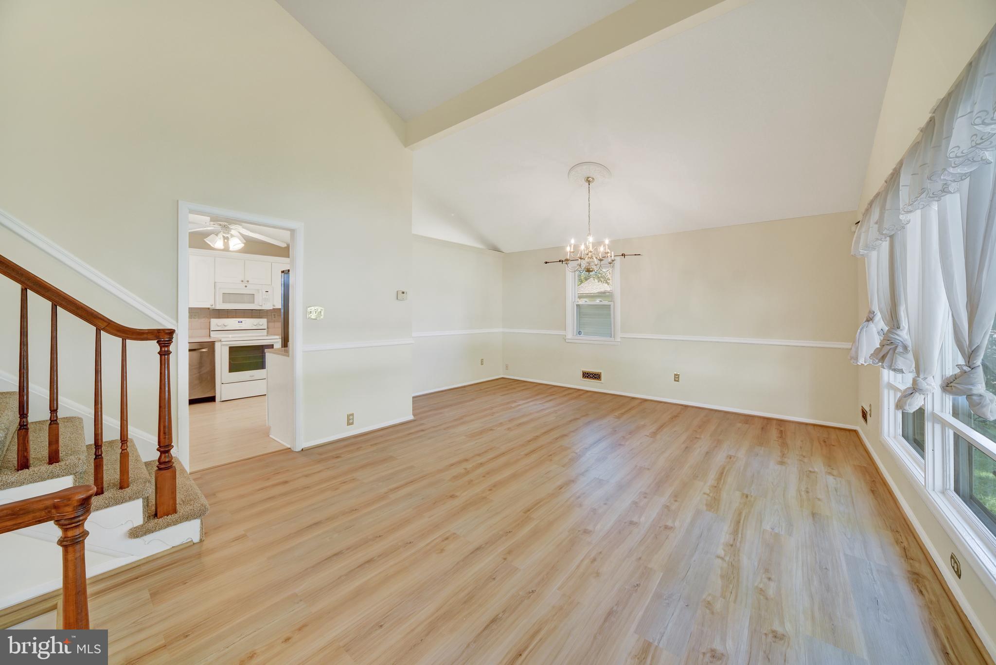 809 Providence Road Towson, MD 21286 - Photo 8 of 26 an empty room with wooden floor and windows