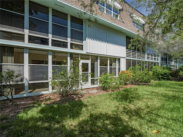 a view of house with yard