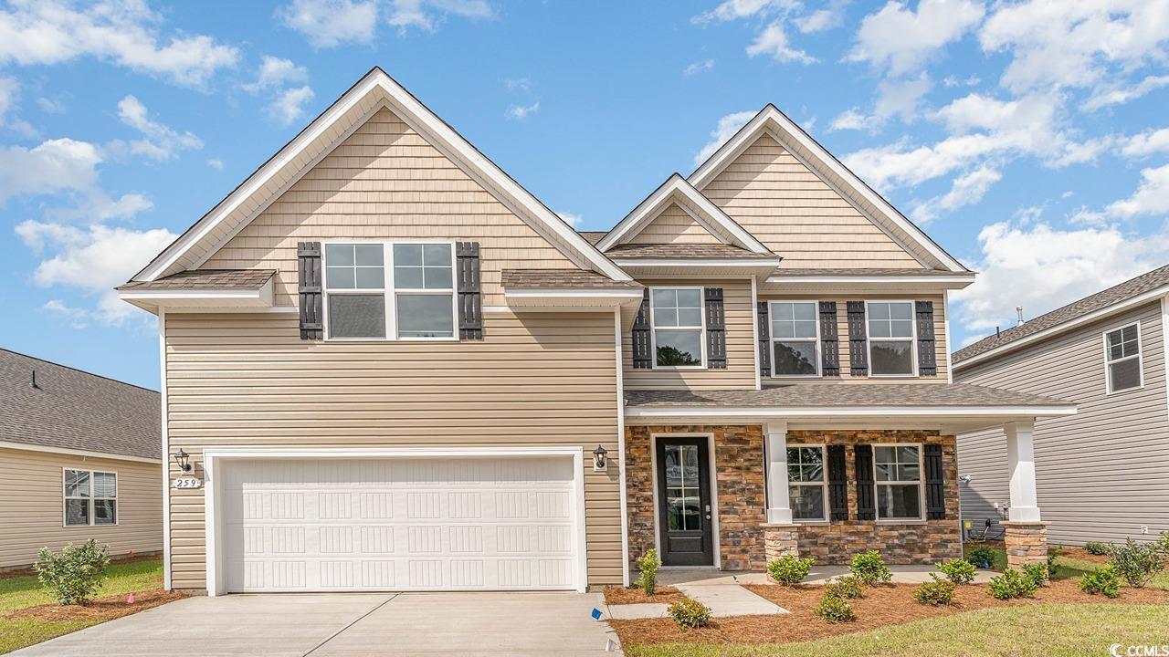 748 Doonbeg Court Conway, SC 29526 - Photo 1 of 30 Craftsman-style house with a shingled roof, an attached garage, driveway, and a porch