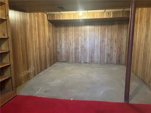 a view of wooden floor and cabinets