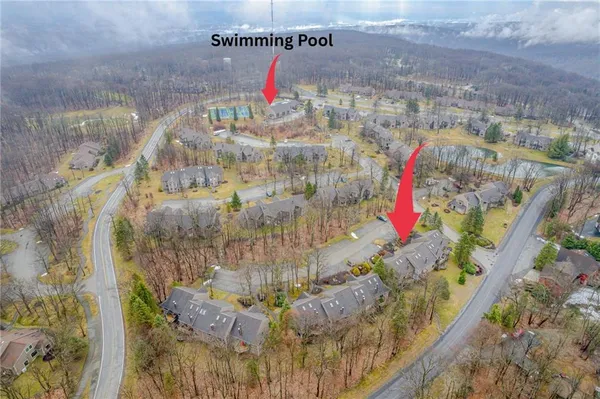 an aerial view of residential houses with outdoor space