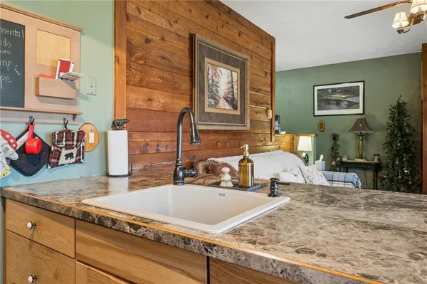 a kitchen with stainless steel appliances granite countertop a stove and a microwave