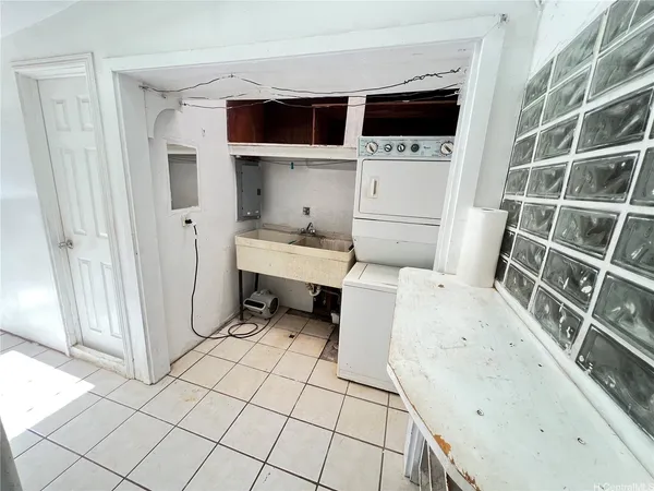 a utility room with dryer and washer