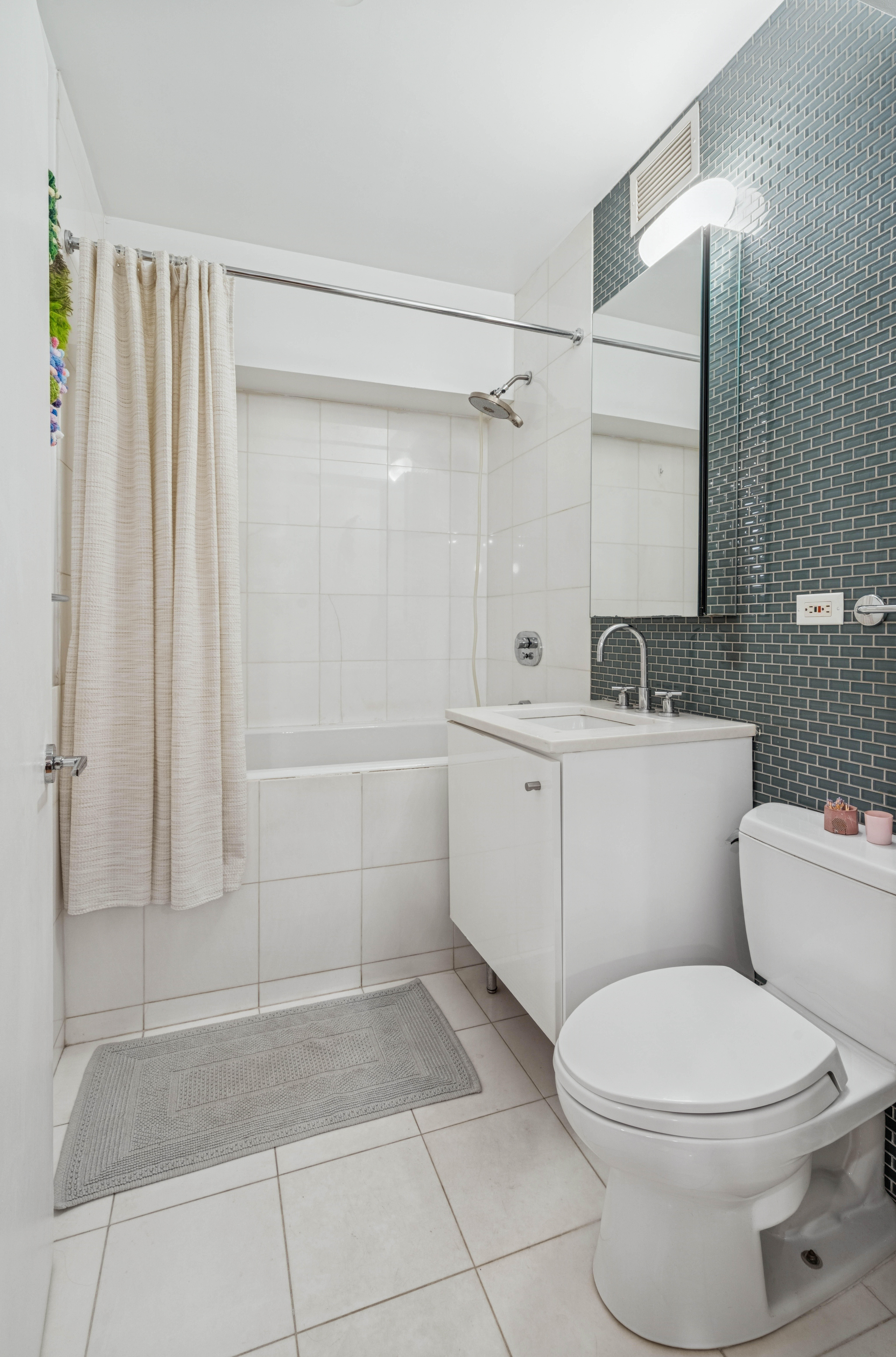 195 Bowery, Unit 4 Manhattan, NY 10002 - Photo 12 of 13 a bathroom with a sink a toilet and shower