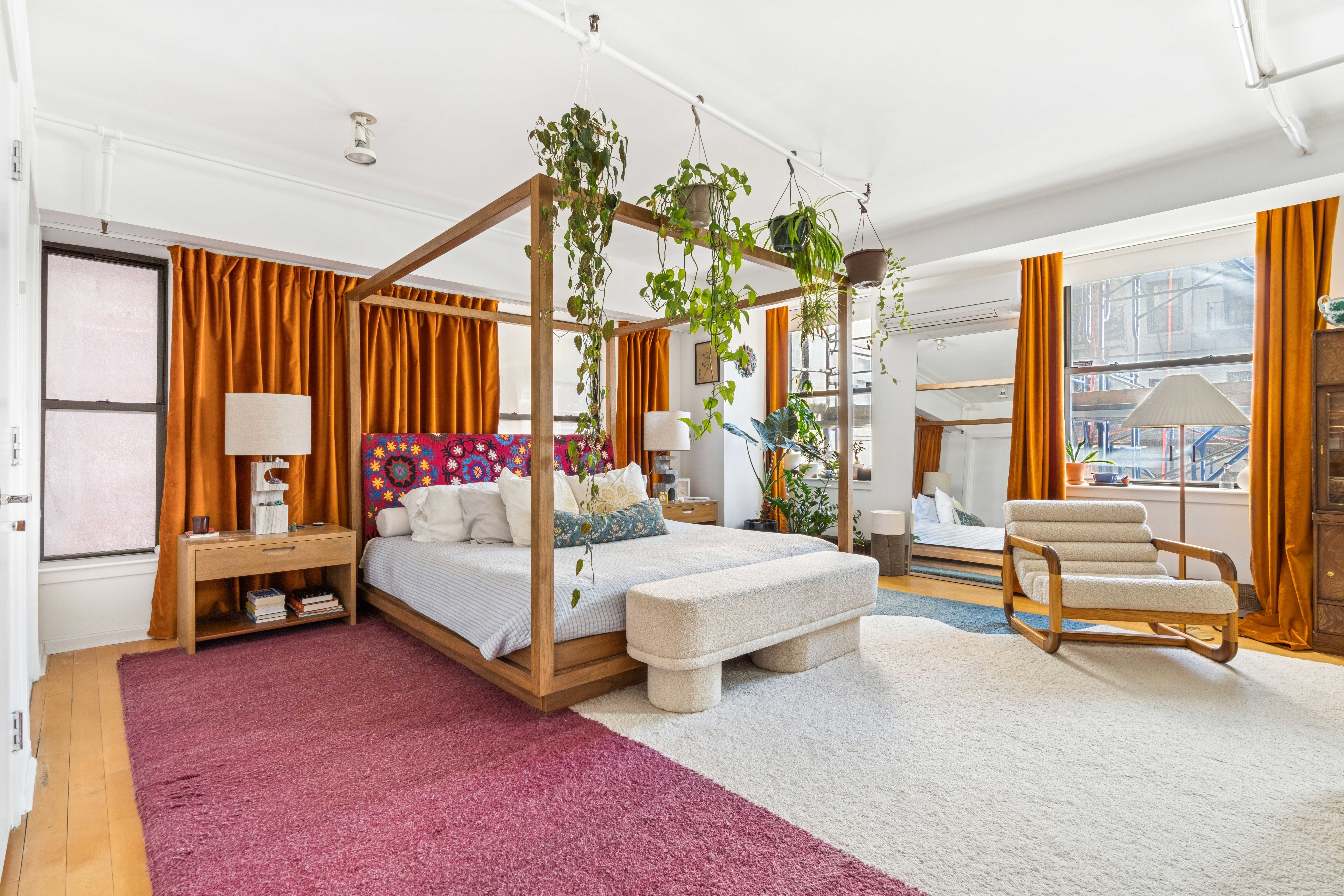 195 Bowery, Unit 4 Manhattan, NY 10002 - Photo 2 of 13 a bedroom with a bed and large windows