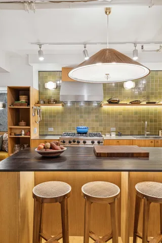 a kitchen with a table and chairs in it