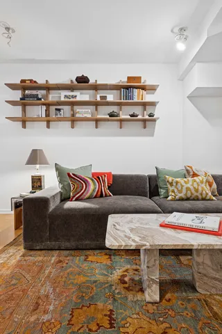a living room with furniture and a table
