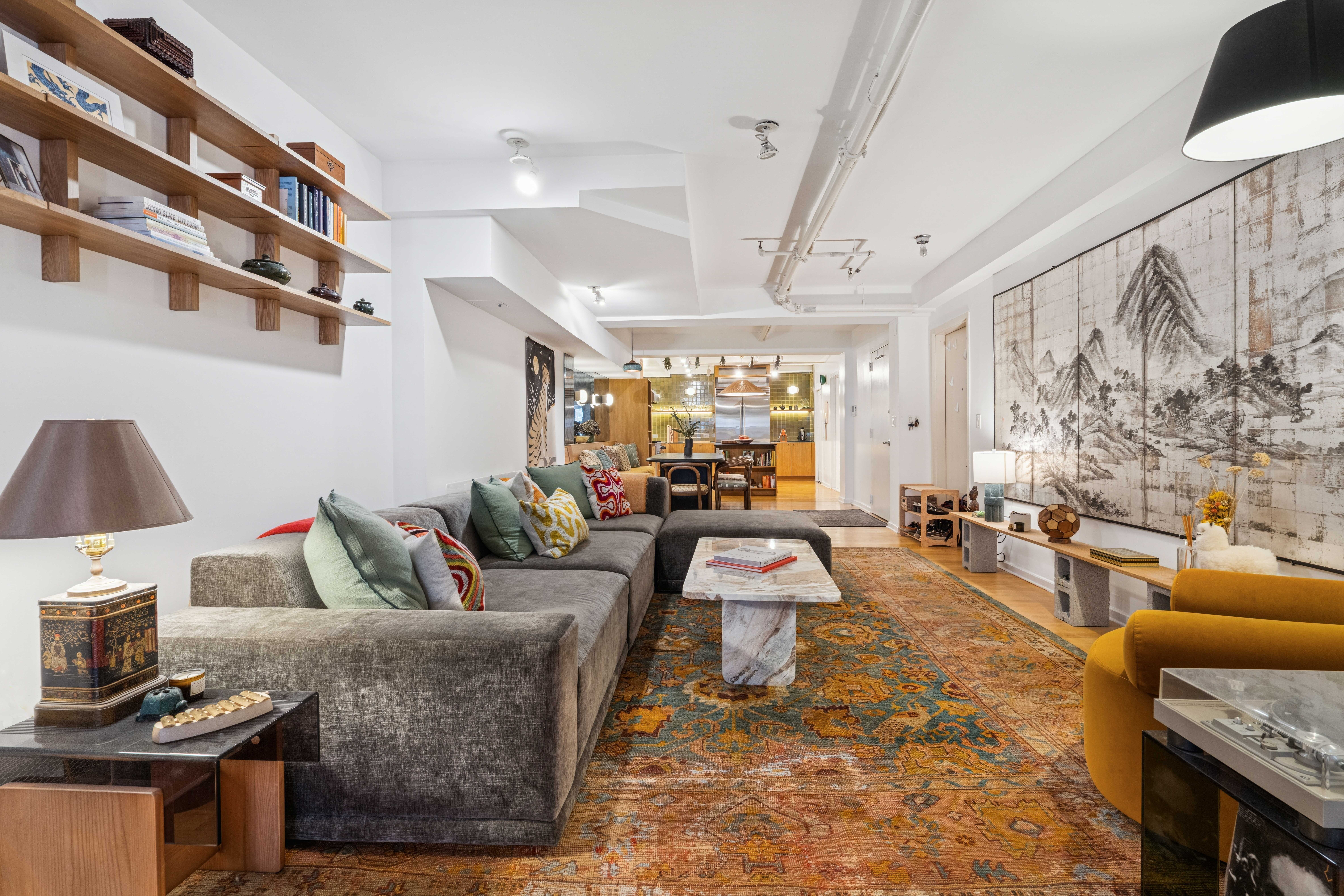 195 Bowery, Unit 4 Manhattan, NY 10002 - Photo 7 of 13 a living room with furniture and a flat screen tv