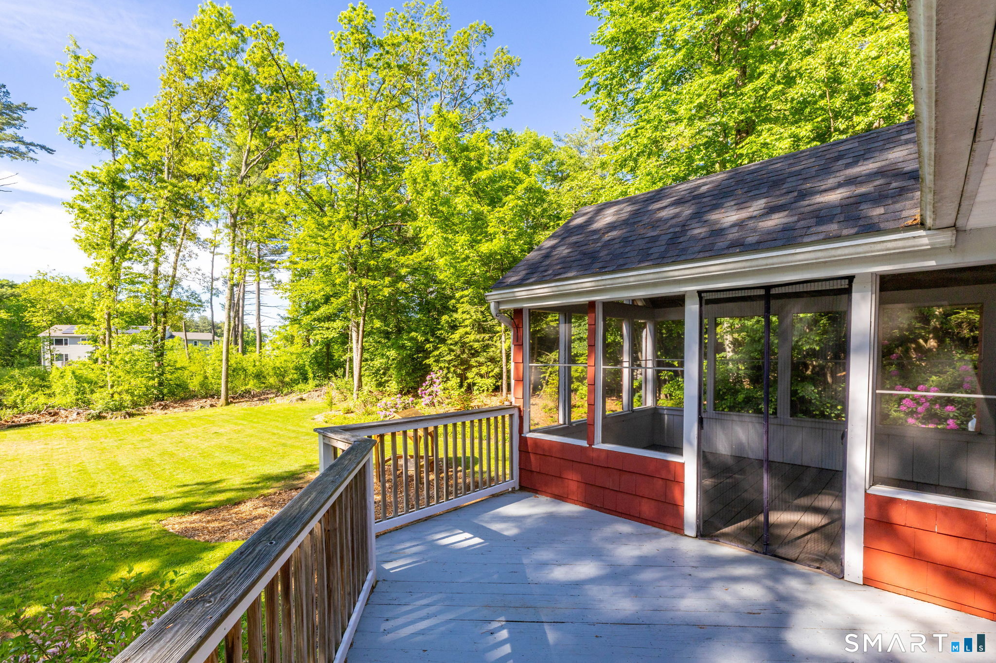 347 Griffin Road Suffield, CT 06093 - Photo 25 of 35 a view of a house with a backyard and floor to ceiling window next to a yard