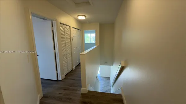 a view of entryway with wooden floor