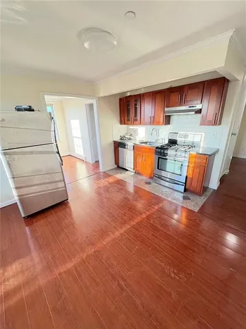 a view of kitchen with furniture and wooden floor