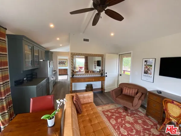 a view of a chair and table in the balcony