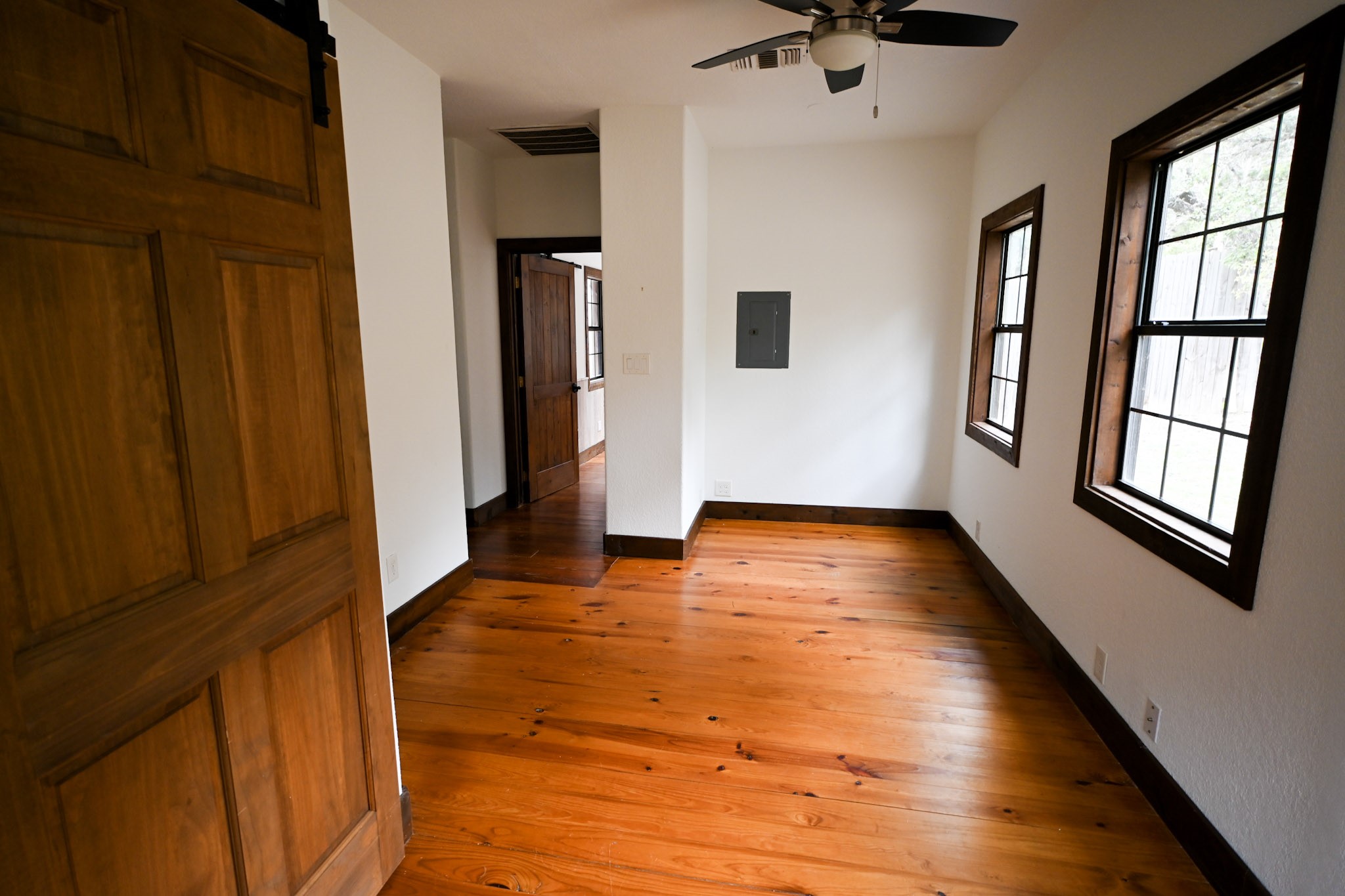 15104 Texas Street Austin, TX 78734 - Photo 12 of 18 a view of an empty room with a window and wooden floor