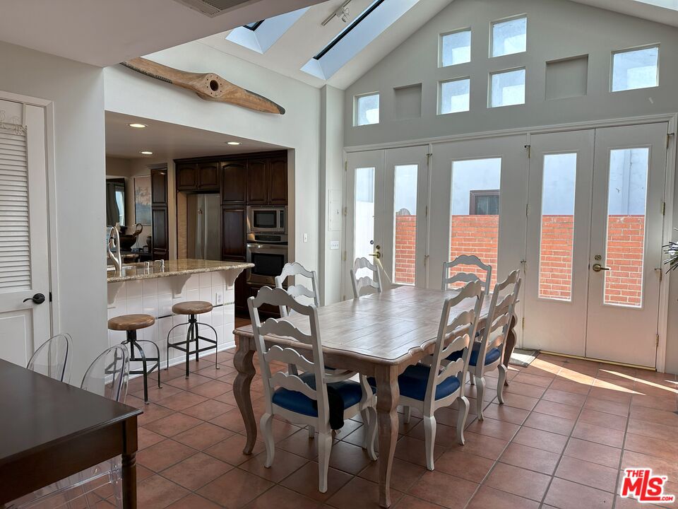 135 Napoleon Street Playa del Rey, CA 90293 - Photo 11 of 36 a view of a dining room with furniture and chandelier