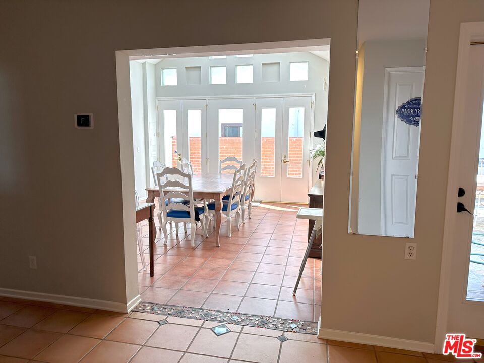 135 Napoleon Street Playa del Rey, CA 90293 - Photo 14 of 36 a view of a dining room with furniture and floor to ceiling window