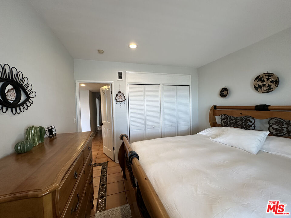 135 Napoleon Street Playa del Rey, CA 90293 - Photo 17 of 36 a bedroom with a bed and a dresser