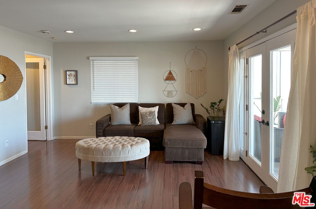 135 Napoleon Street Playa del Rey, CA 90293 - Photo 23 of 36 a living room with furniture and a wooden floor