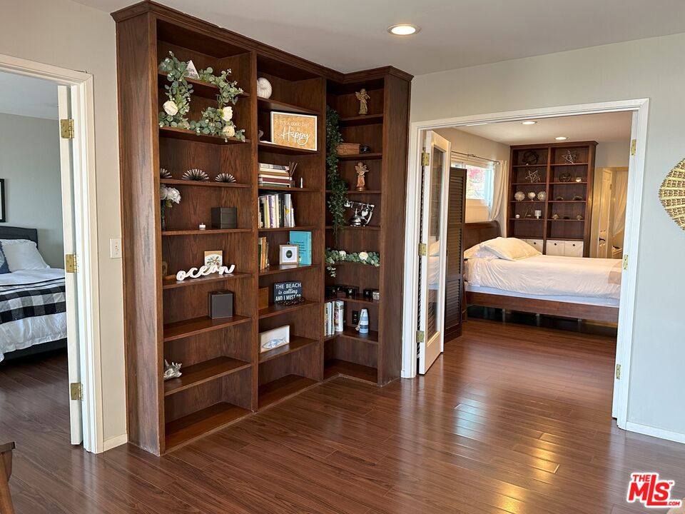 135 Napoleon Street Playa del Rey, CA 90293 - Photo 26 of 36 a bedroom with furniture and wooden floor