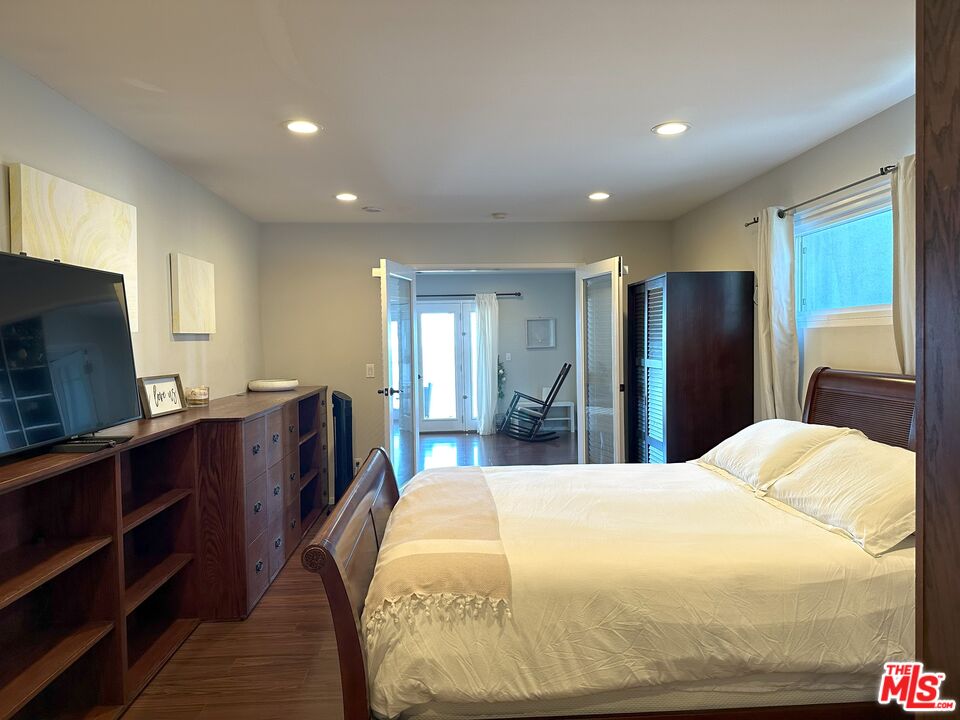 135 Napoleon Street Playa del Rey, CA 90293 - Photo 27 of 36 a bedroom with a large bed and furniture