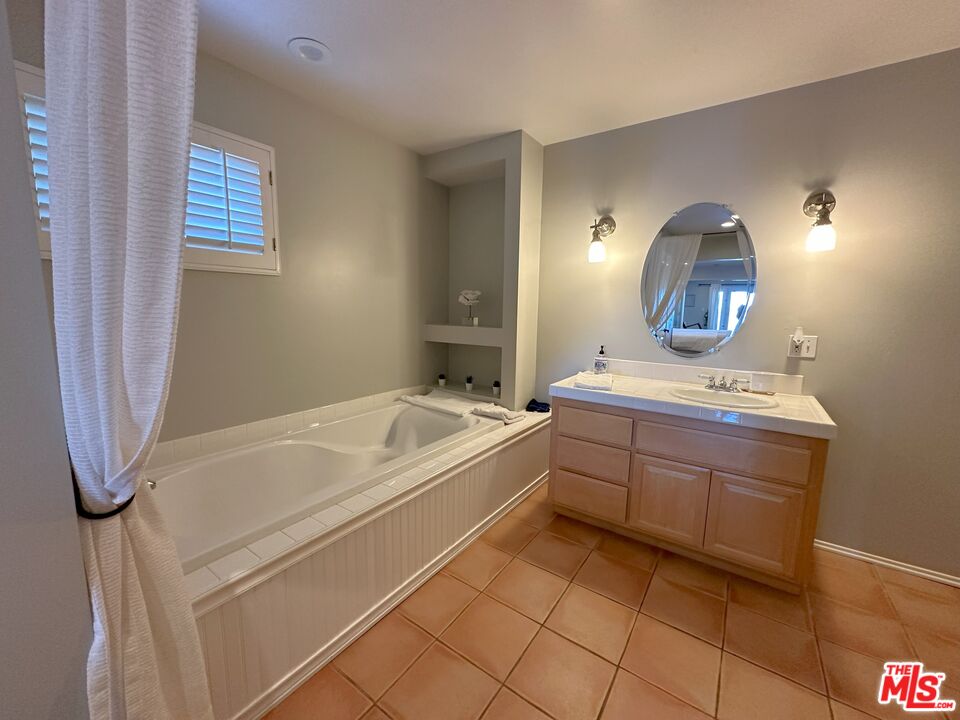 135 Napoleon Street Playa del Rey, CA 90293 - Photo 28 of 36 a spacious bathroom with a sink and a mirror