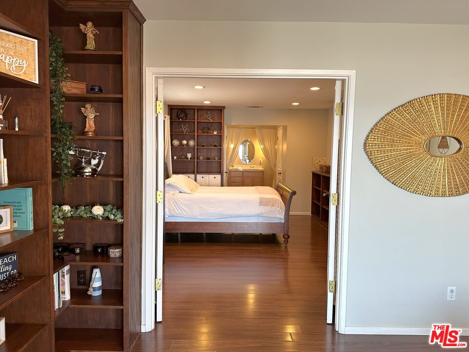 135 Napoleon Street Playa del Rey, CA 90293 - Photo 30 of 36 a view of a bedroom with a bed and wooden floor