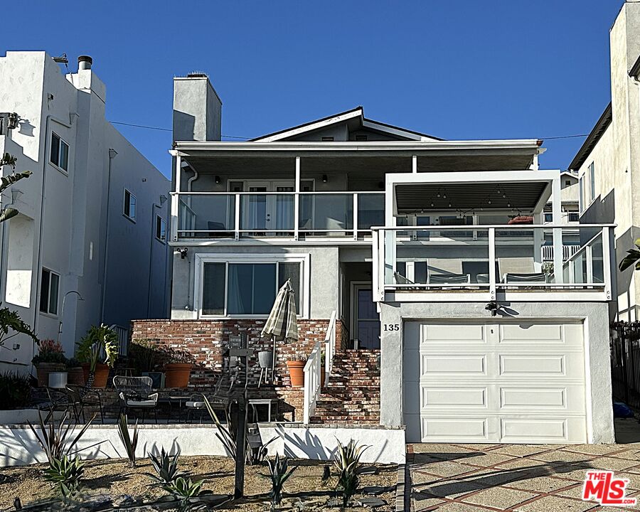 135 Napoleon Street Playa del Rey, CA 90293 - Photo 3 of 36 a front view of a house with parking space