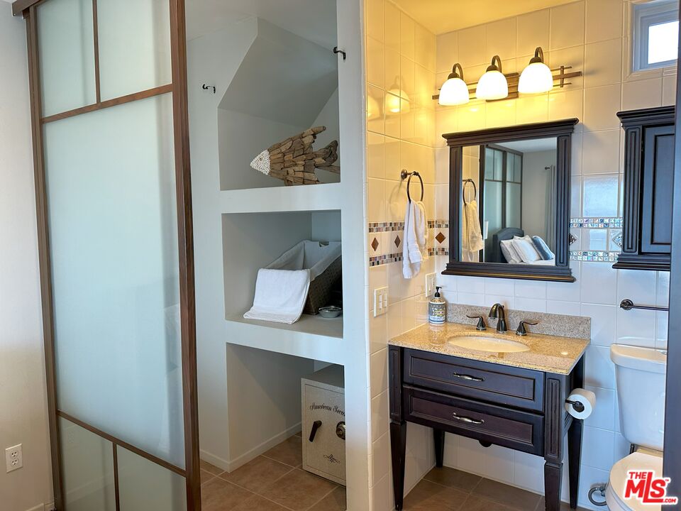135 Napoleon Street Playa del Rey, CA 90293 - Photo 34 of 36 a bathroom with a sink and a mirror