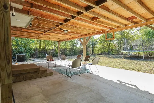 a view of a swimming pool with a patio