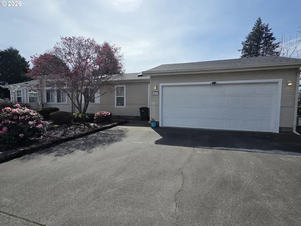 a view of backyard and garage
