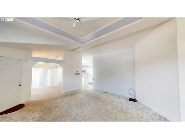 a open hall with a painting on the wall