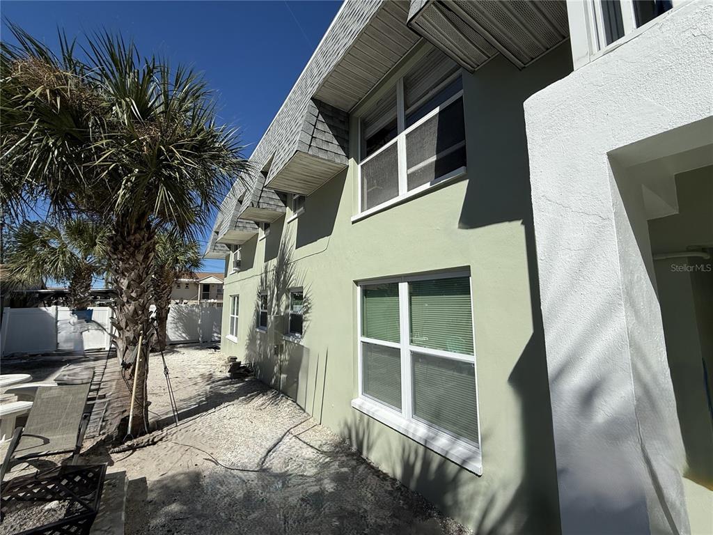 14120 Palm Street, Unit 103 Madeira Beach, FL 33708 - Photo 14 of 19 a view of house with a outdoor space