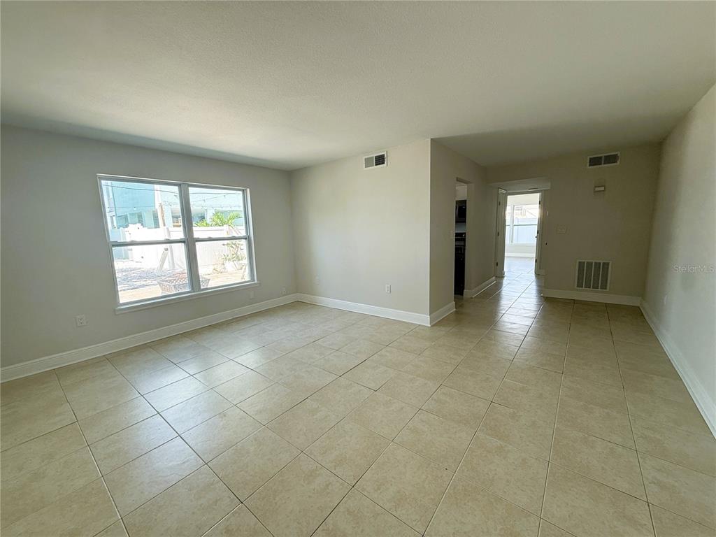 14120 Palm Street, Unit 104 Madeira Beach, FL 33708 - Photo 2 of 18 a view of an empty room with a window
