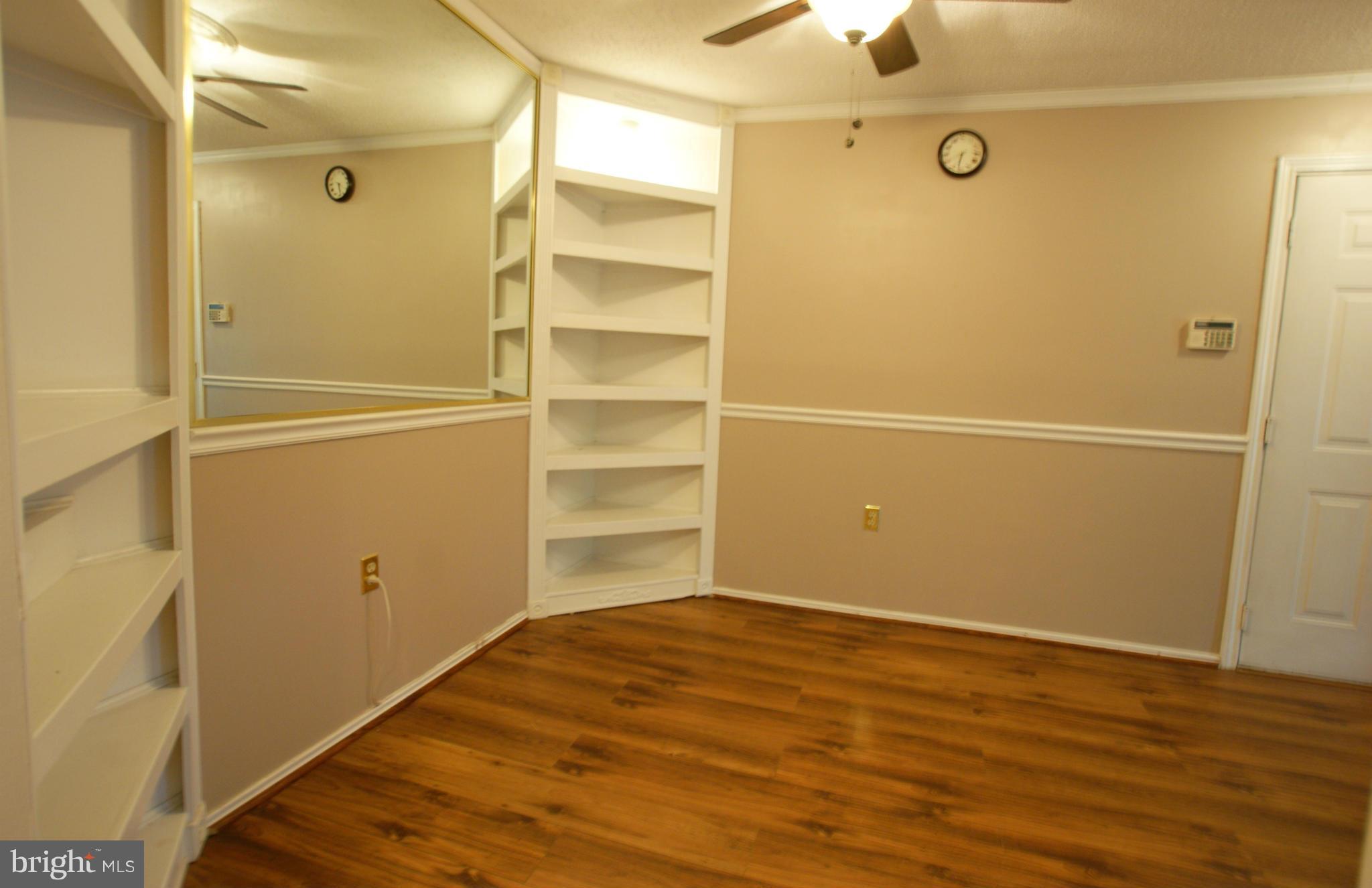 21007 Timber Ridge Terrace, Unit 201 Ashburn, VA 20147 - Photo 6 of 18 Dining Room w/ Lit Built Ins