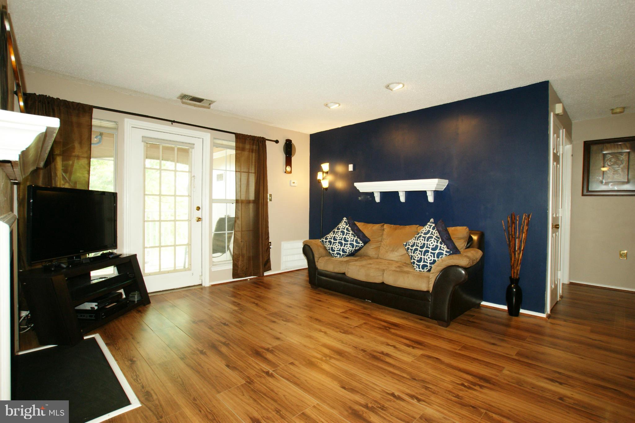 21007 Timber Ridge Terrace, Unit 201 Ashburn, VA 20147 - Photo 7 of 18 New Flooring Throughout
