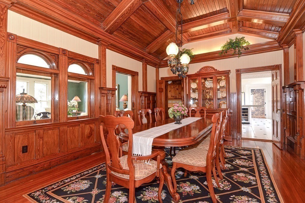 202 Paine Street Bellingham, MA 02019 - Photo 11 of 42 a view of a dining room with furniture wooden floor and chandelier