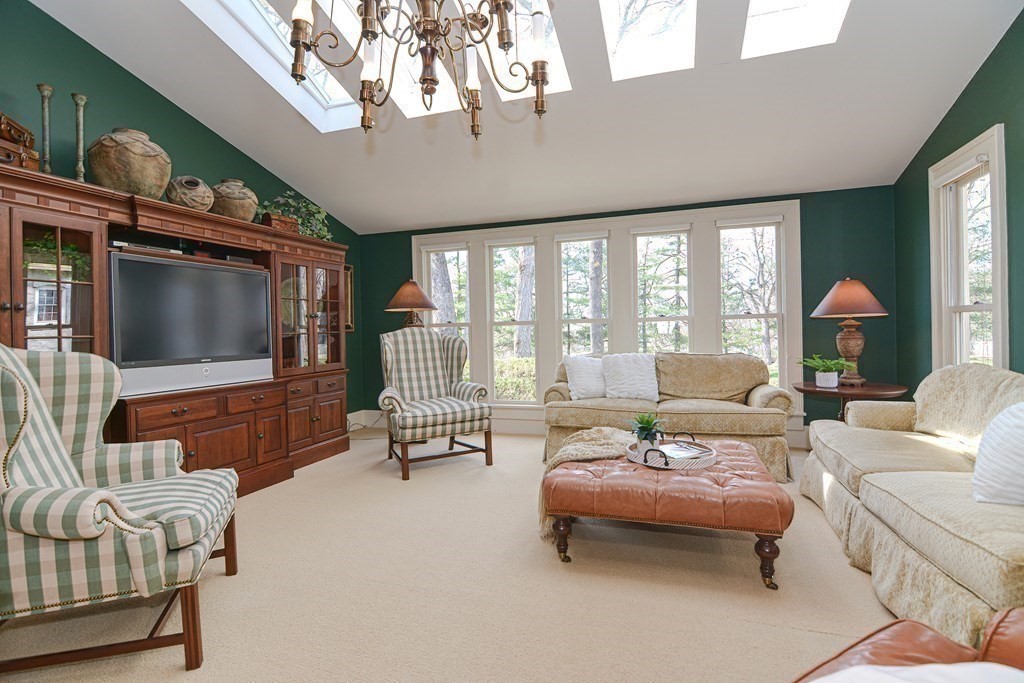202 Paine Street Bellingham, MA 02019 - Photo 13 of 42 a living room with furniture and a flat screen tv