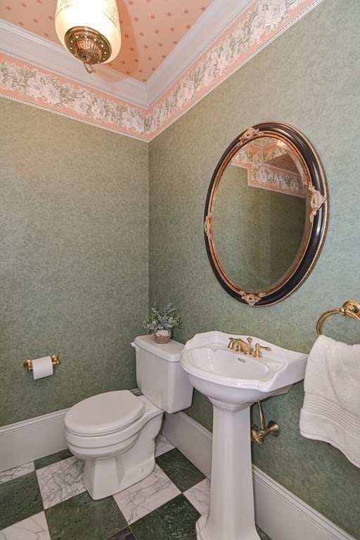 202 Paine Street Bellingham, MA 02019 - Photo 18 of 42 a bathroom with a toilet sink and mirror