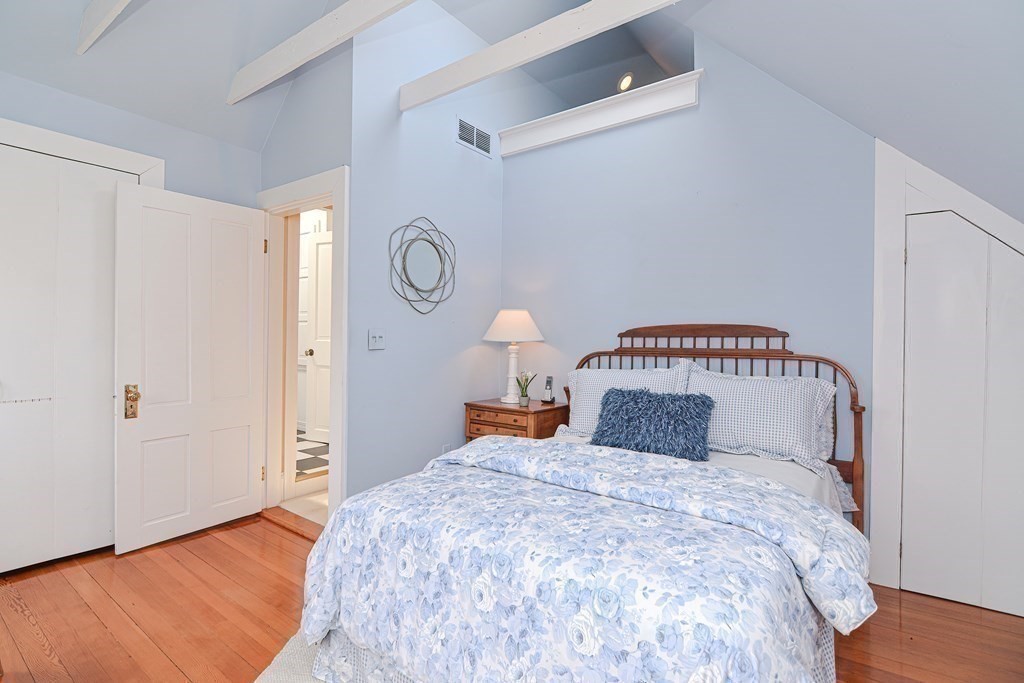 202 Paine Street Bellingham, MA 02019 - Photo 19 of 42 a bedroom with a bed and a window